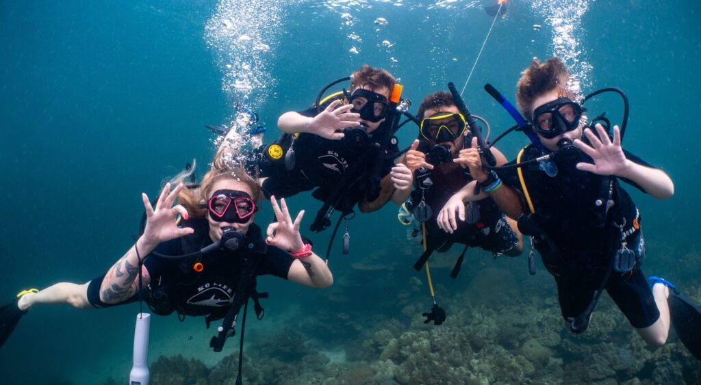 People on shared scuba diving tour at daymaniyat island