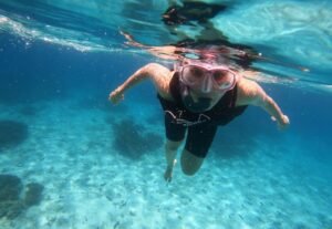 Snorkeling among colourful fish and coral at the Daymaniyat Islands in Oman
