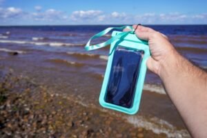 Smartphone protected inside a waterproof pouch for outdoor adventures