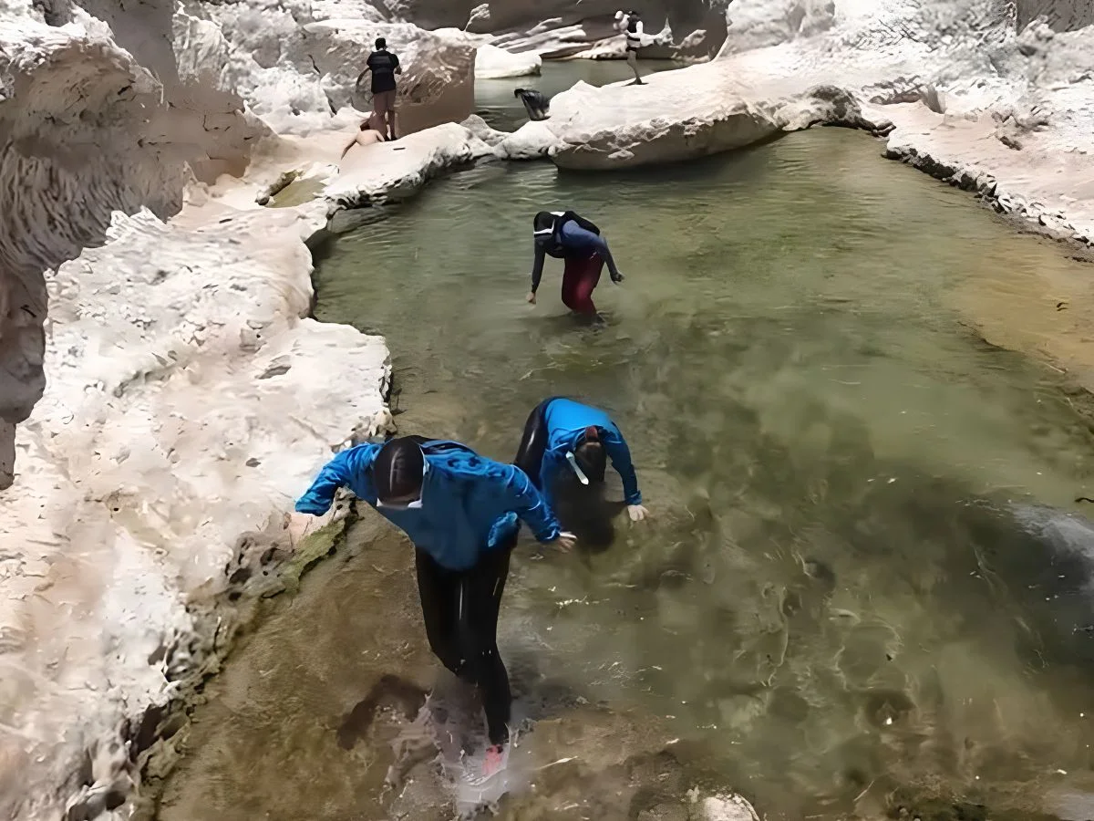 Small group exploring Wadi Shab with a local guide in Oman