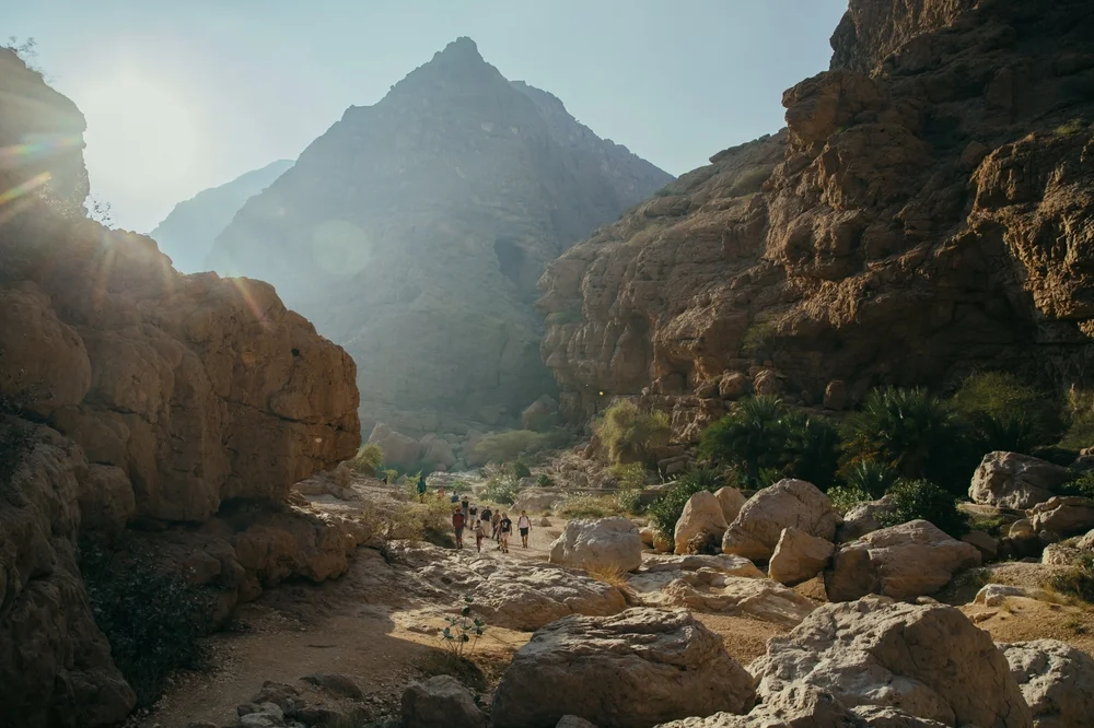 Wadi Shab Oman hiking trail with visitors